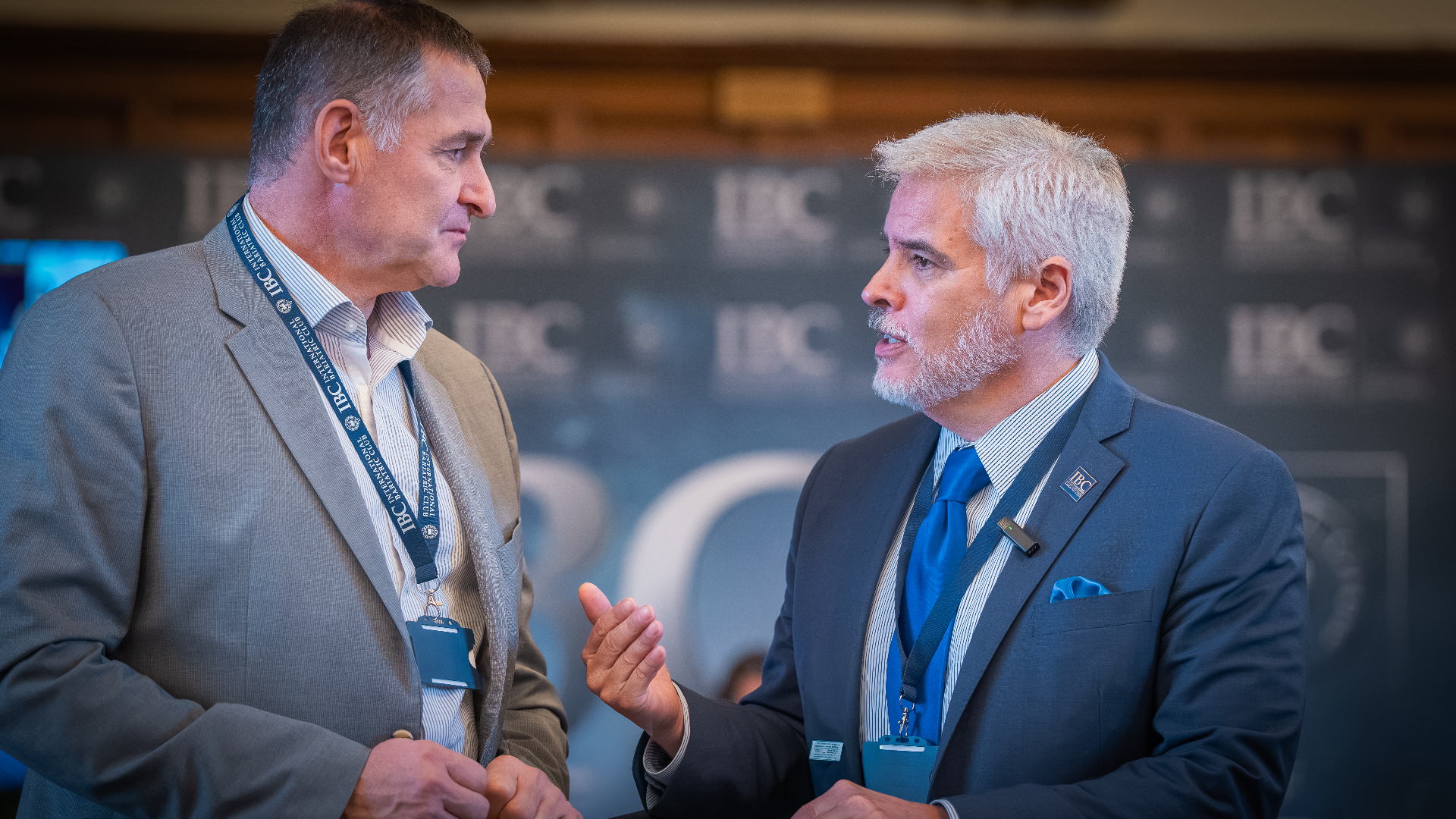 Dr. Ortiz in conversation with a colleague at an IBC event.